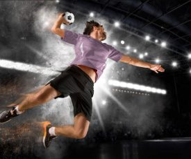 Caucasian young handball player in action. Concept of sport, movement, energy, dynamic,