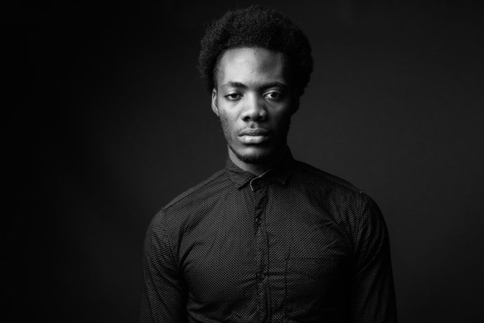 Black and white portrait of handsome African man
